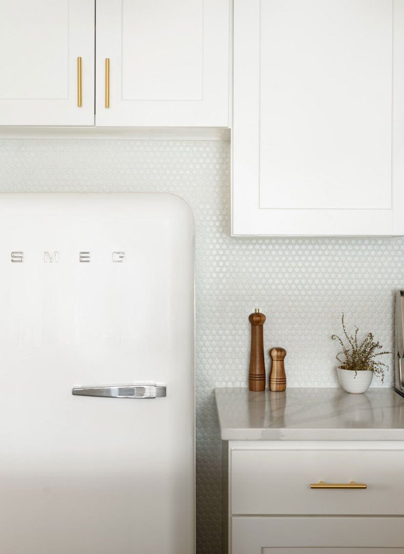 all-white apartment kitchen