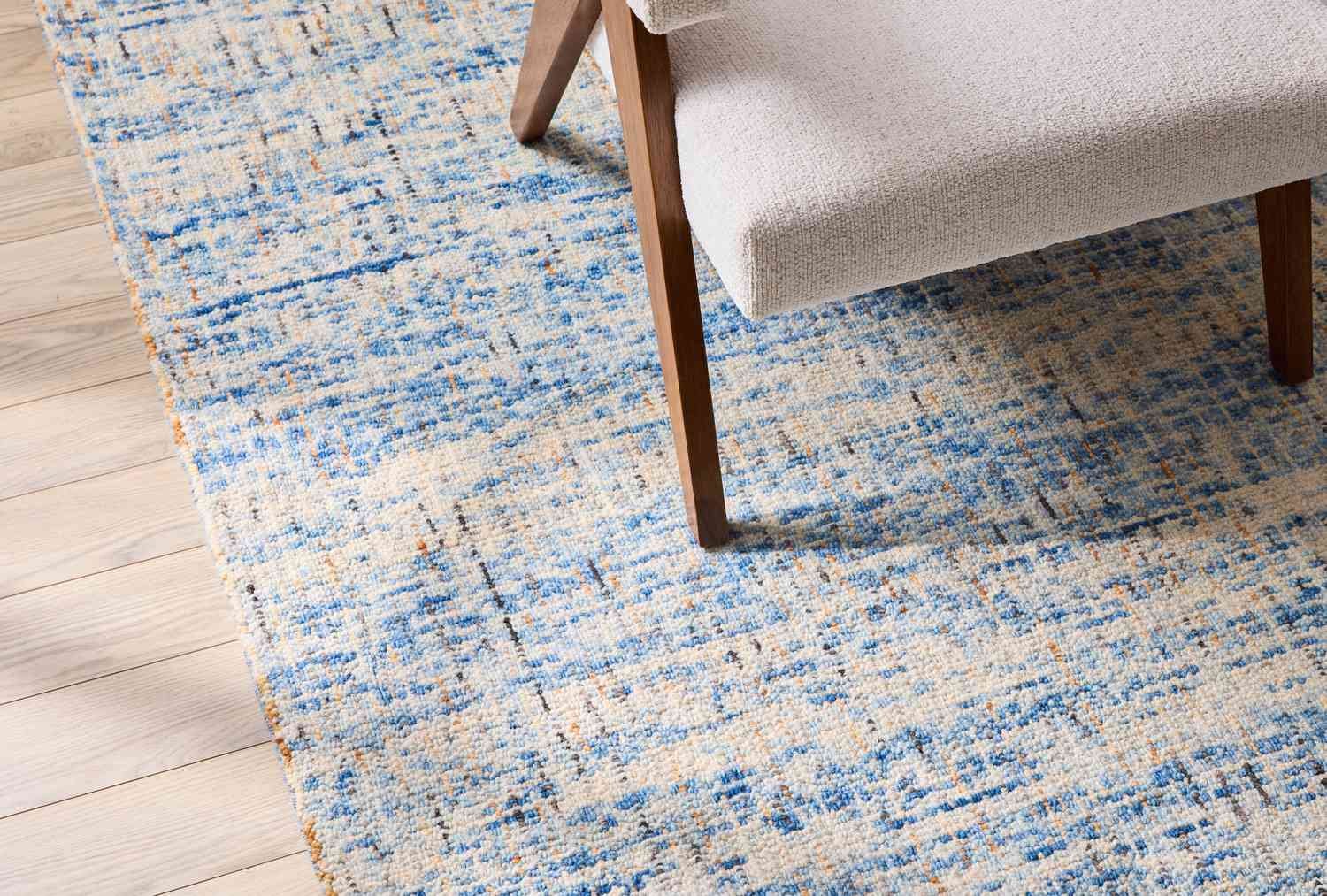 Hand-hooked rug on floor