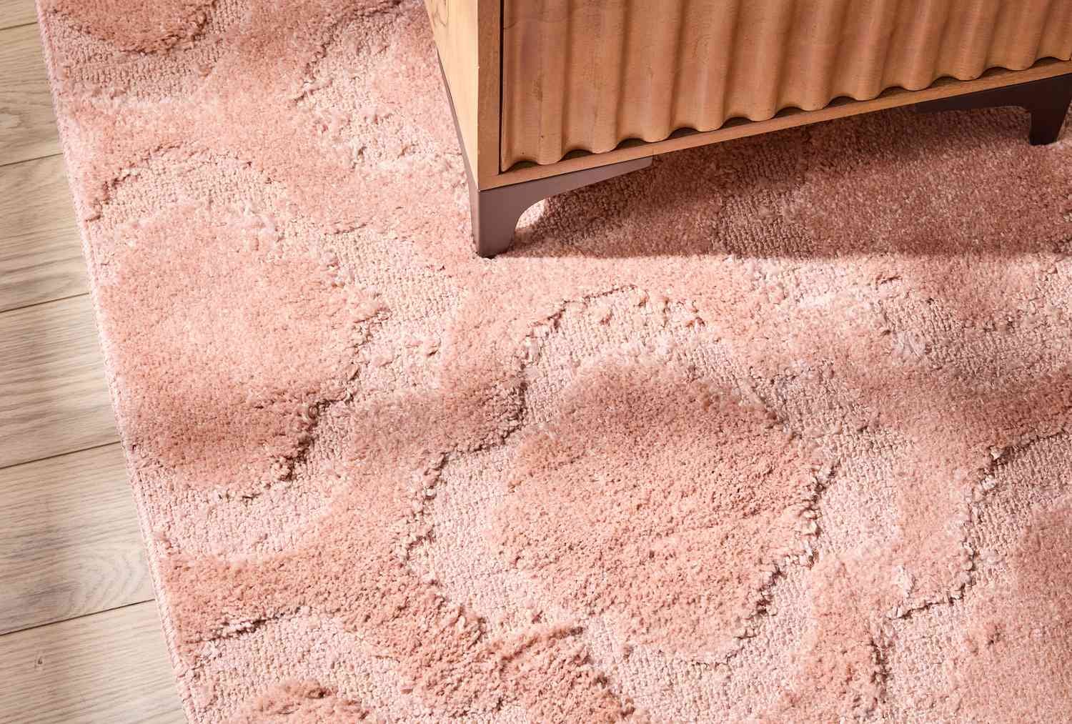 Hand-loomed rug on floor