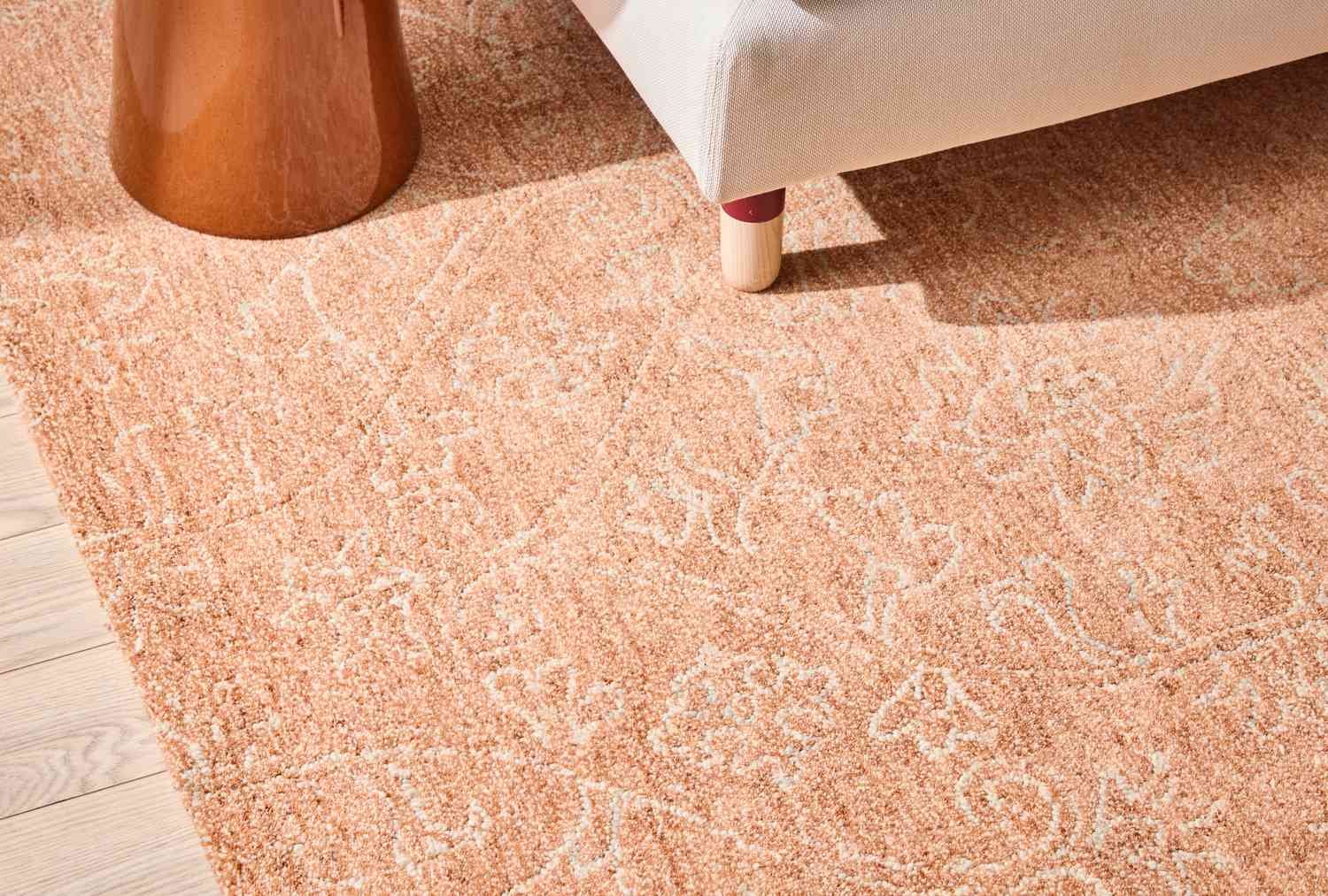 Hand-tufted rug on wood floor