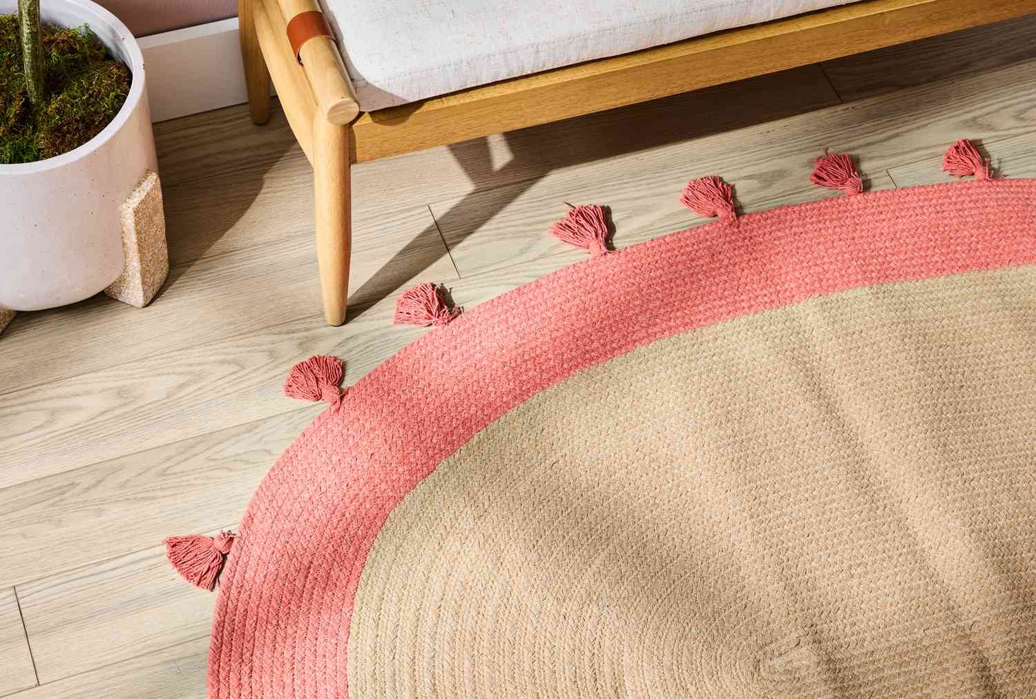 Braided jute rug against wood floor