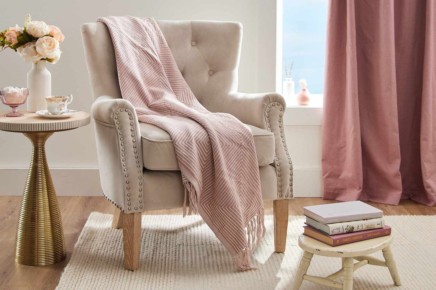 Chesterfield chair with English rolled arms in living room