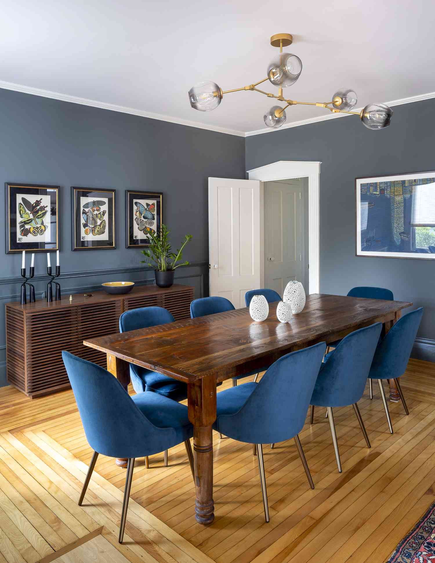 Mid-century modern dining room with teal and wood.