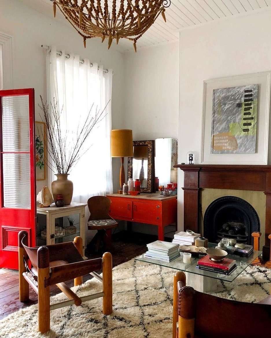 Mid century modern living room with red and teak colors.