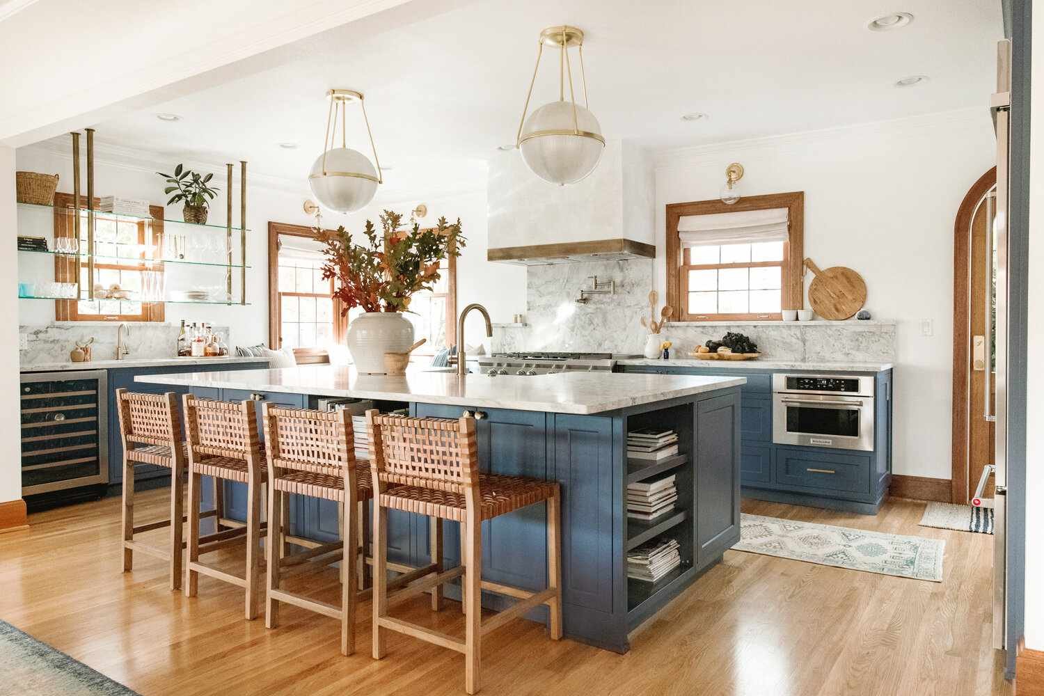 Mid century modern kitchen with blue and natural wood.