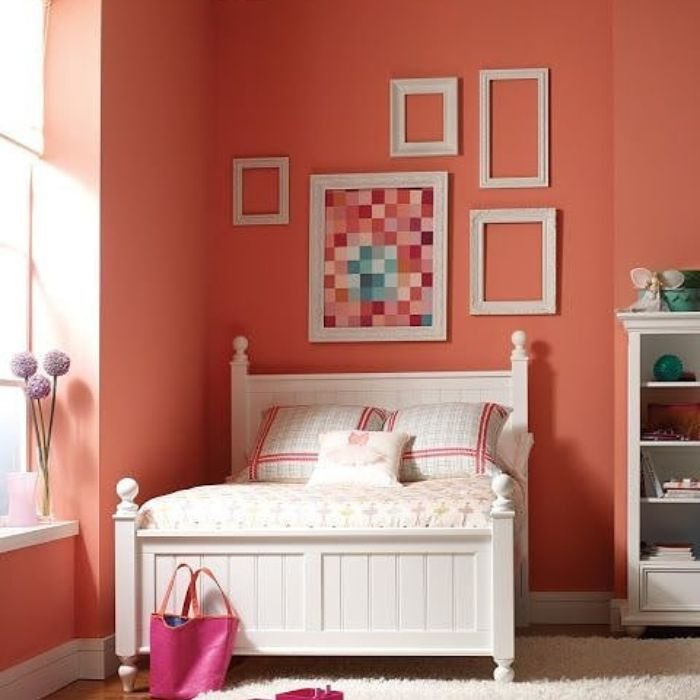 Coral paint color in a bedroom.
