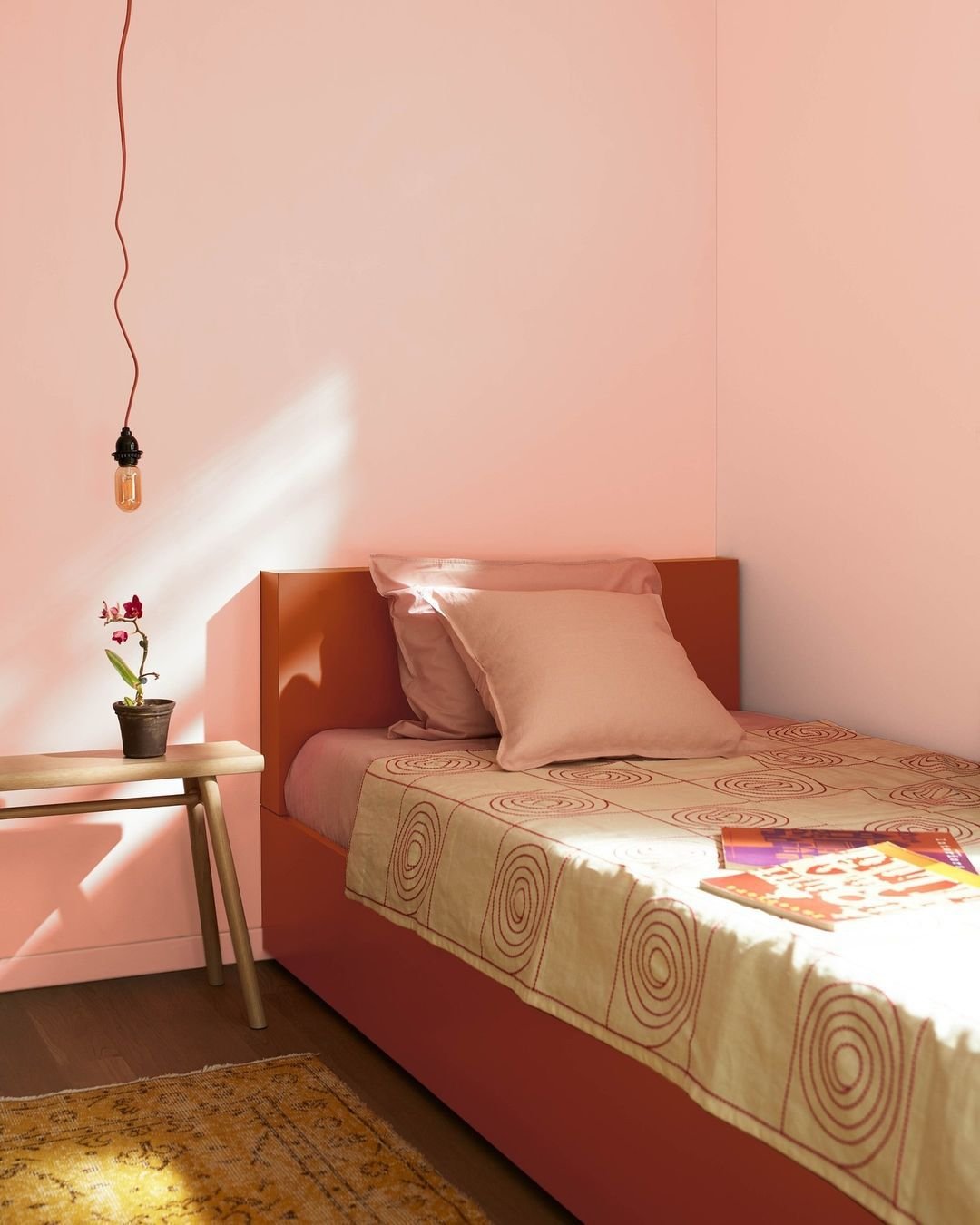 Coral paint color in bedroom.