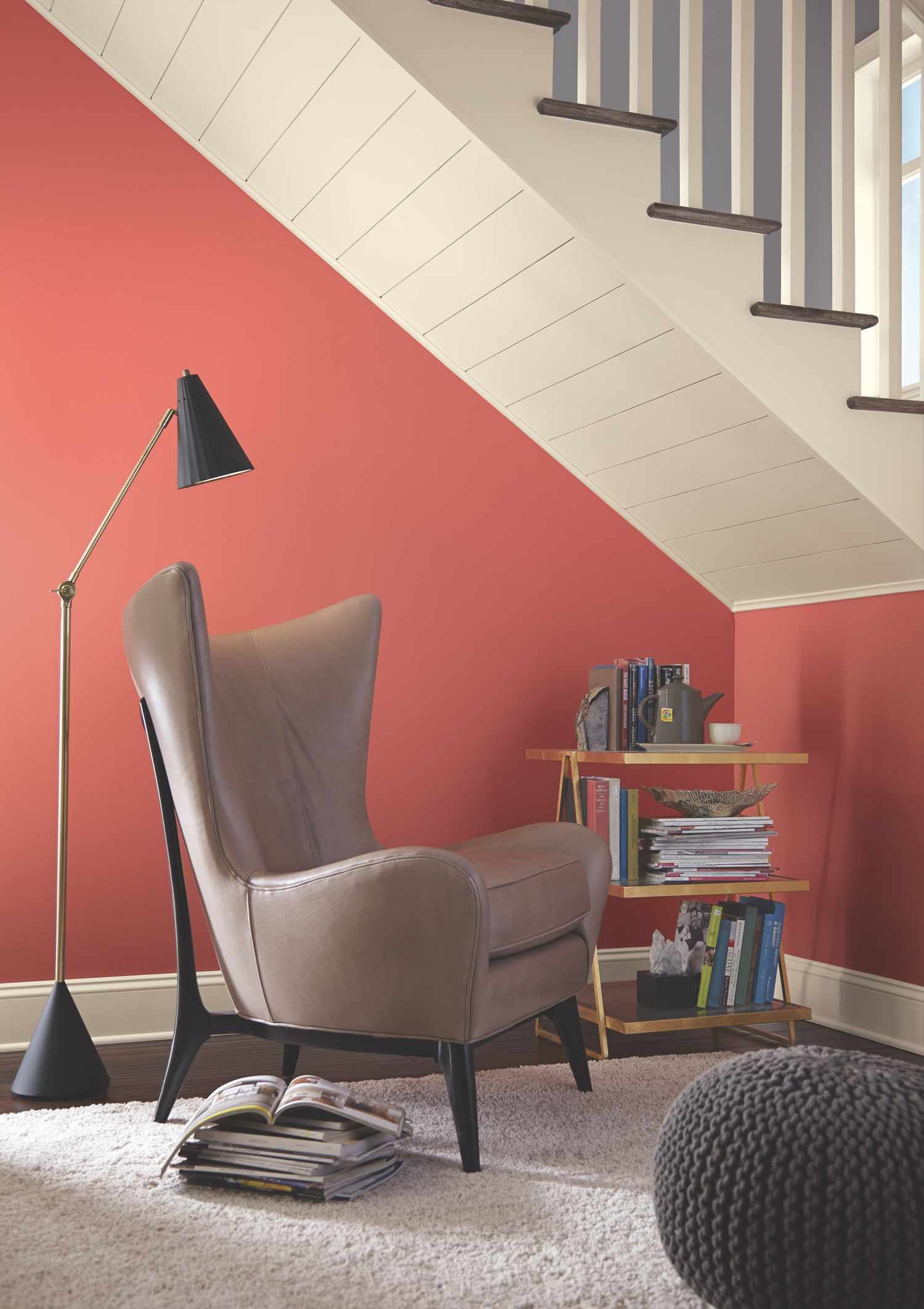 Coral paint color in reading nook.