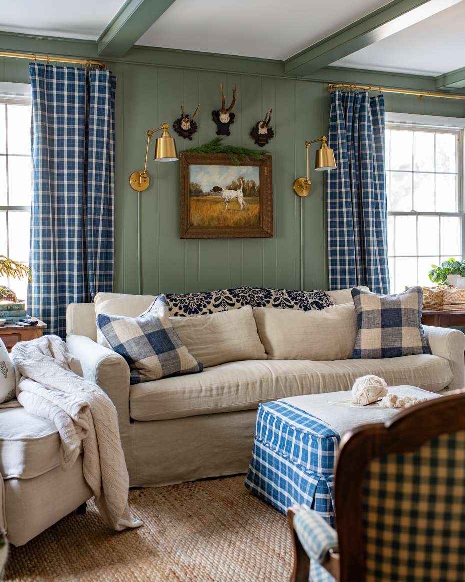sage green living room with blue and white checkered curatins