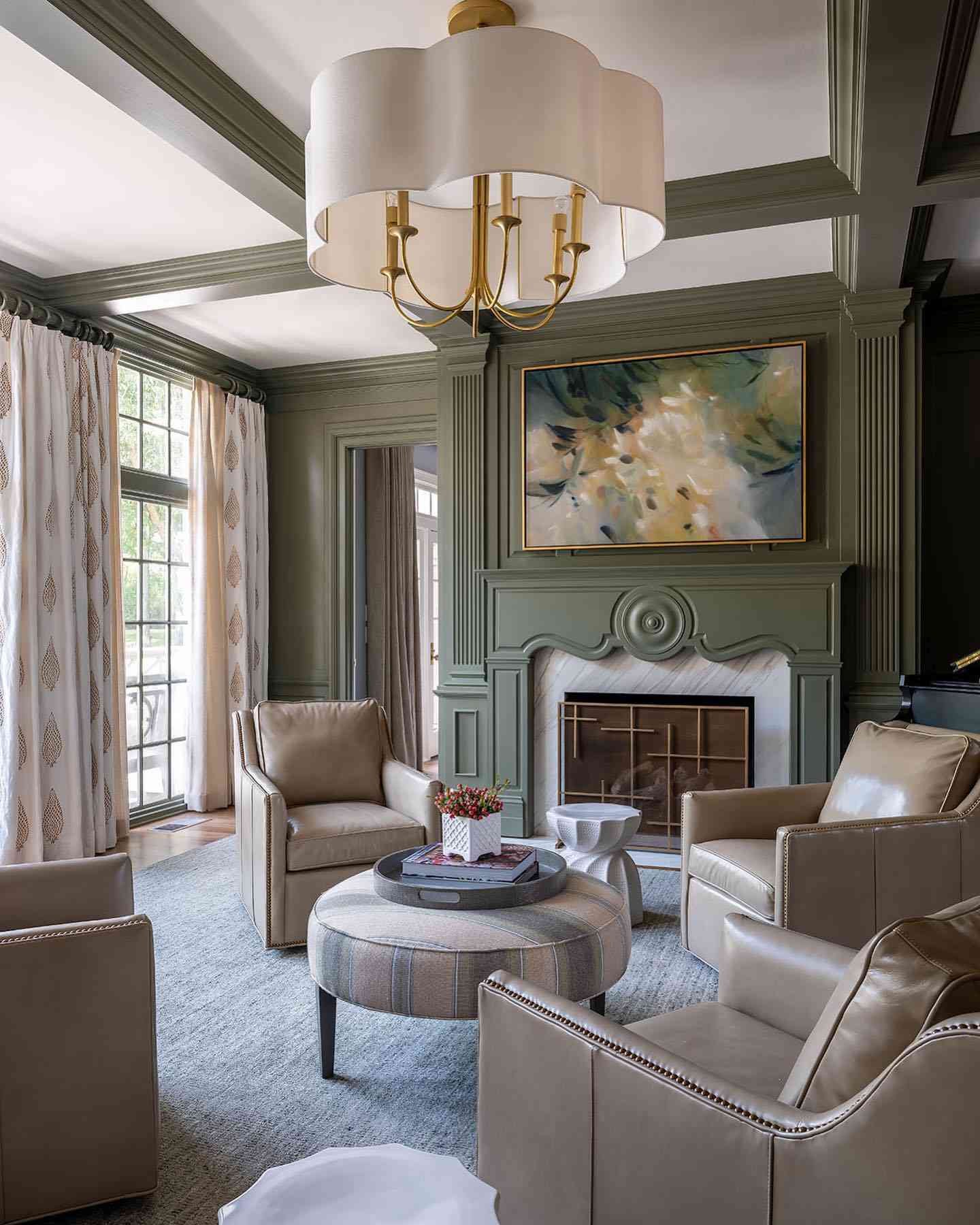 sage green living room with intricate molding