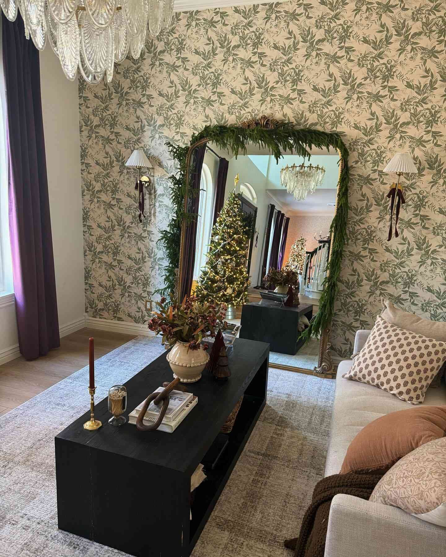 living room with sage green floral wallpaper