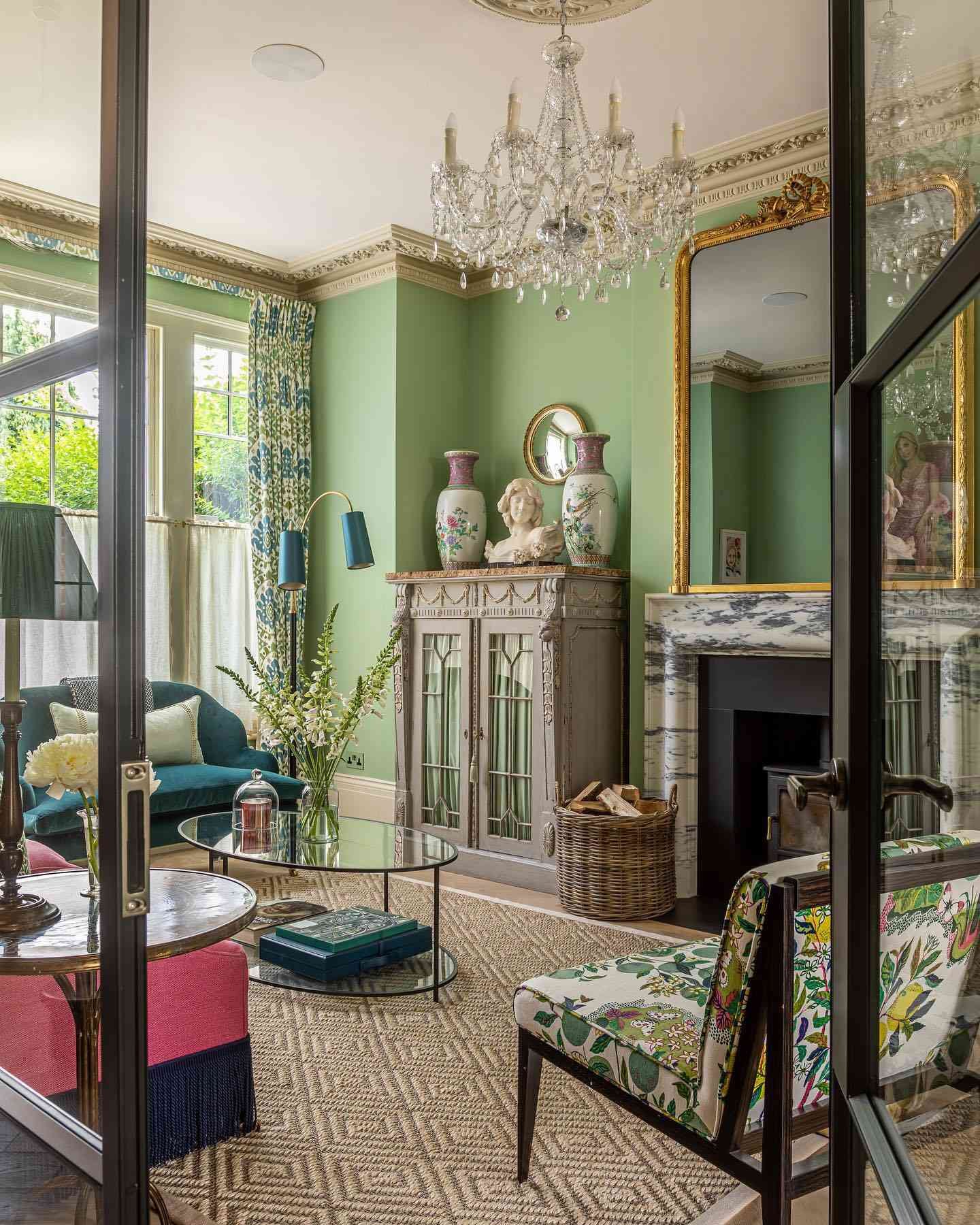 opulence sage green living room with ornate wall mirror
