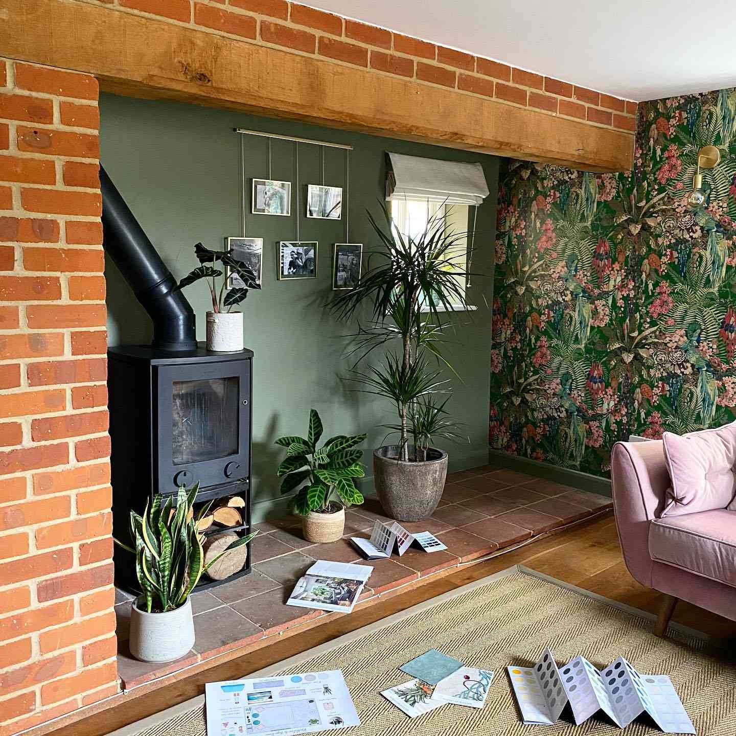 sage green living room nook with fireplace and pink living room