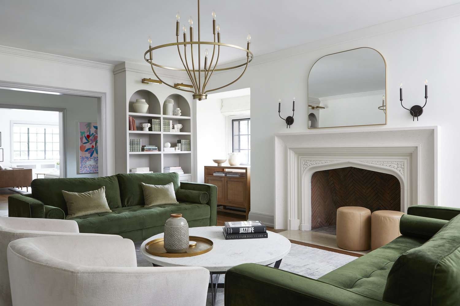 white living room with sage green couches