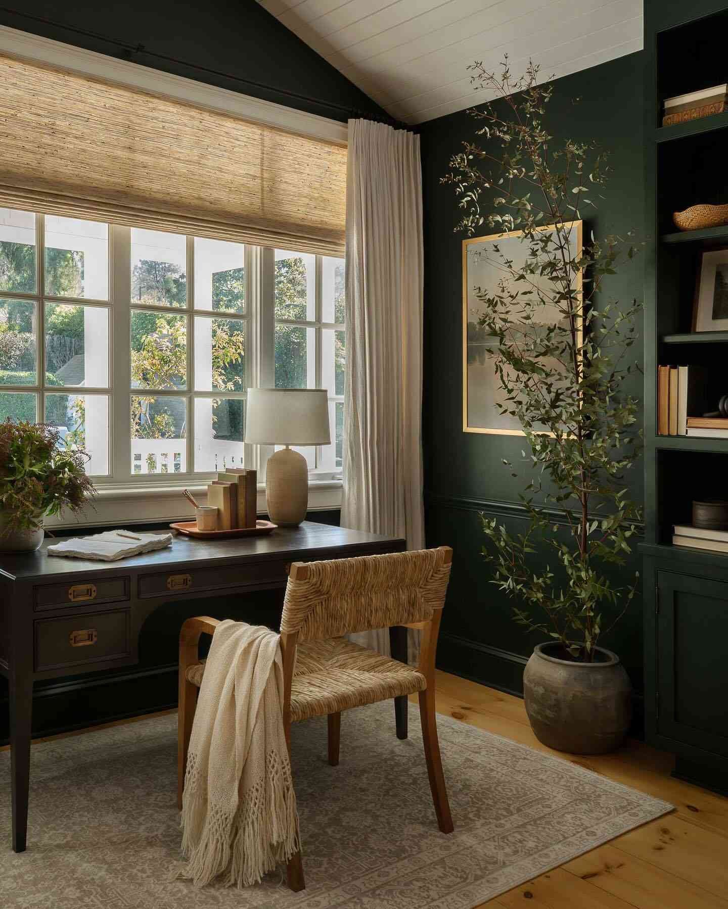 earthy green living room with desk area