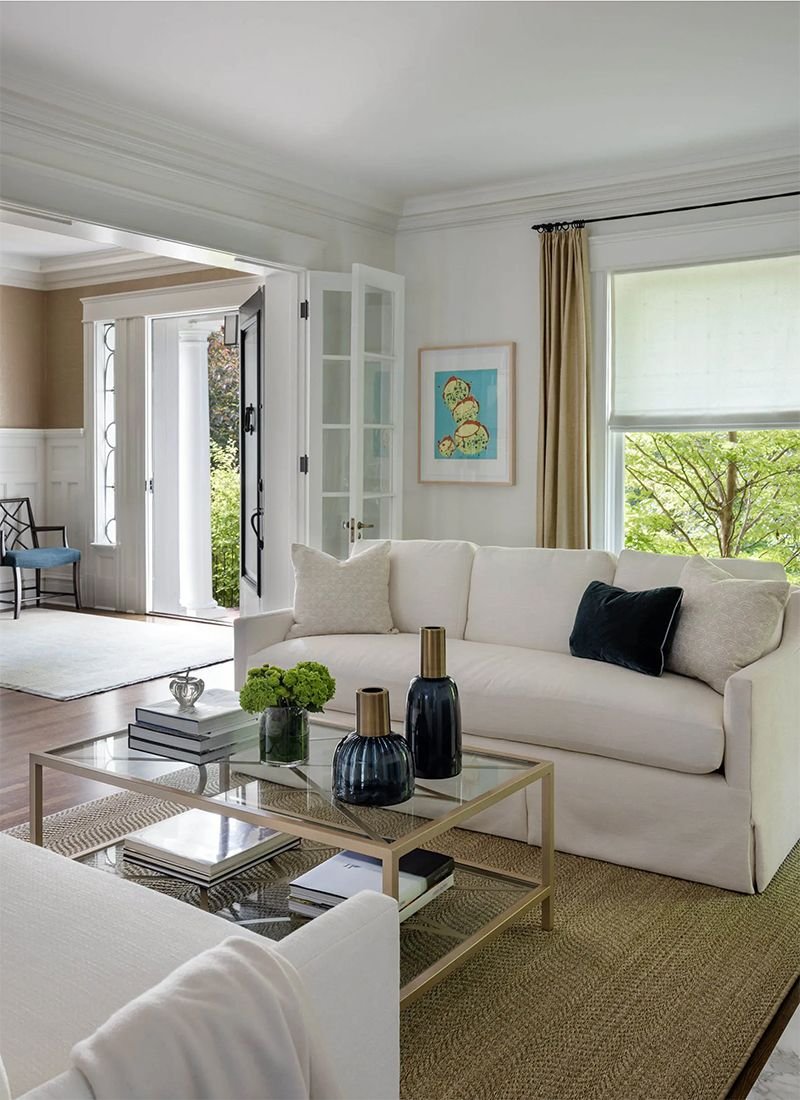 LeeAnn Baker Interiors living room with glass-top table.