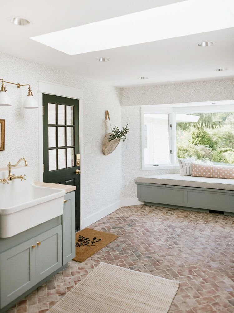 mudroom laundry room with skylights