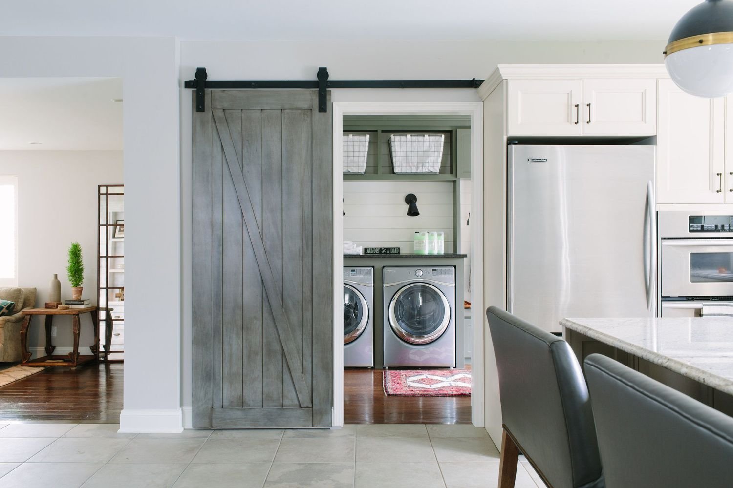 mudroom laundry room with barn door