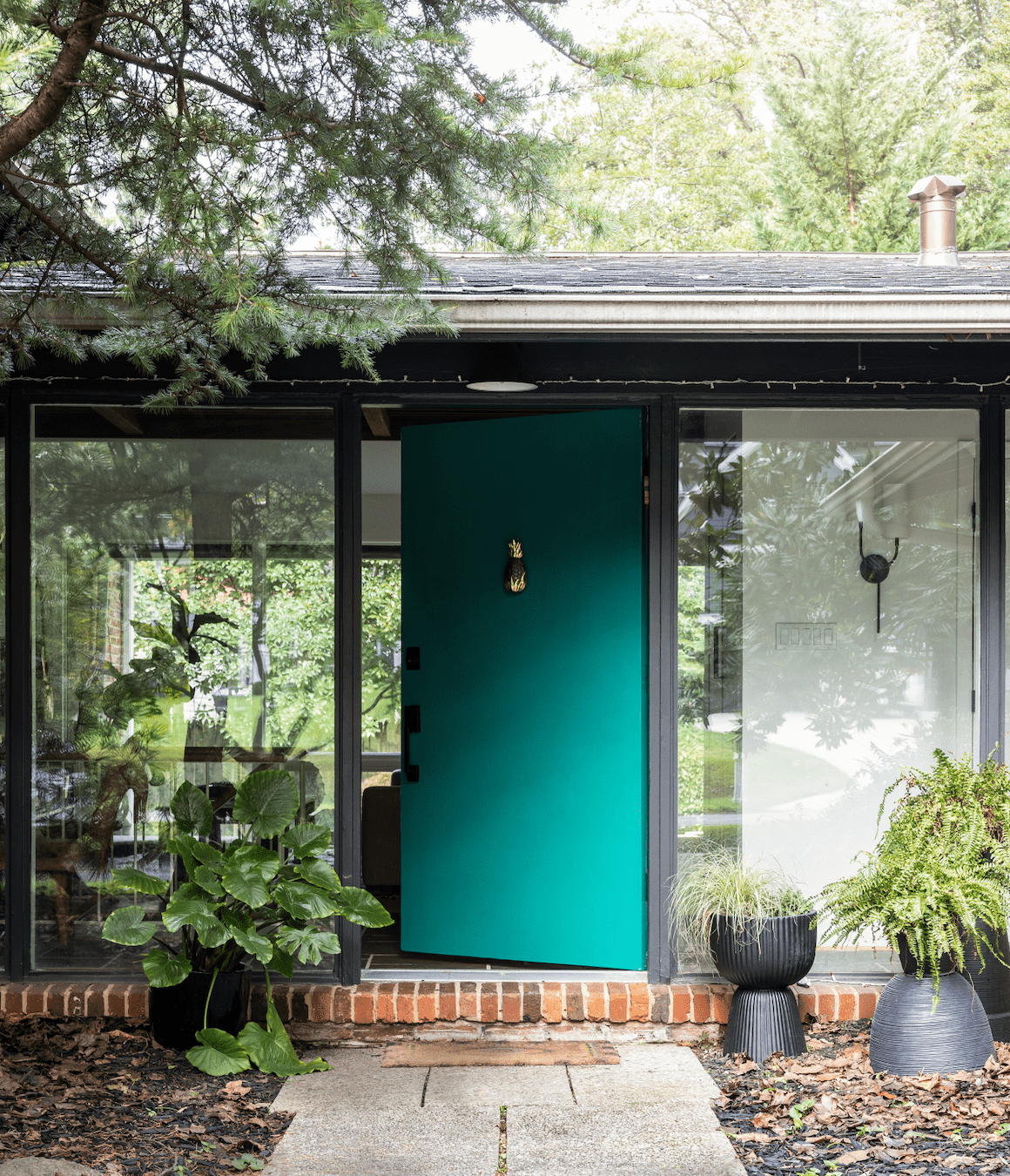 mid-century home with blue door