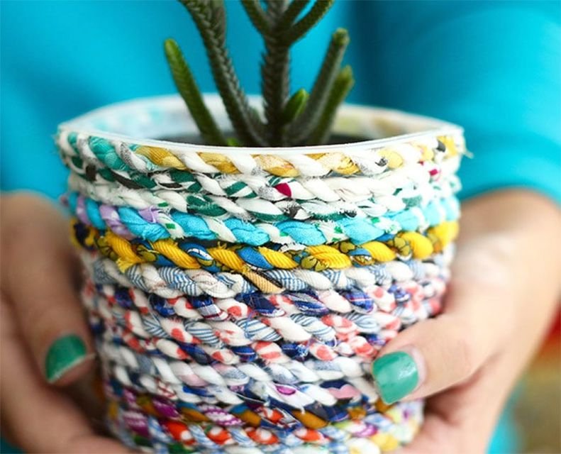 Fabric braided together and wrapped around a planter