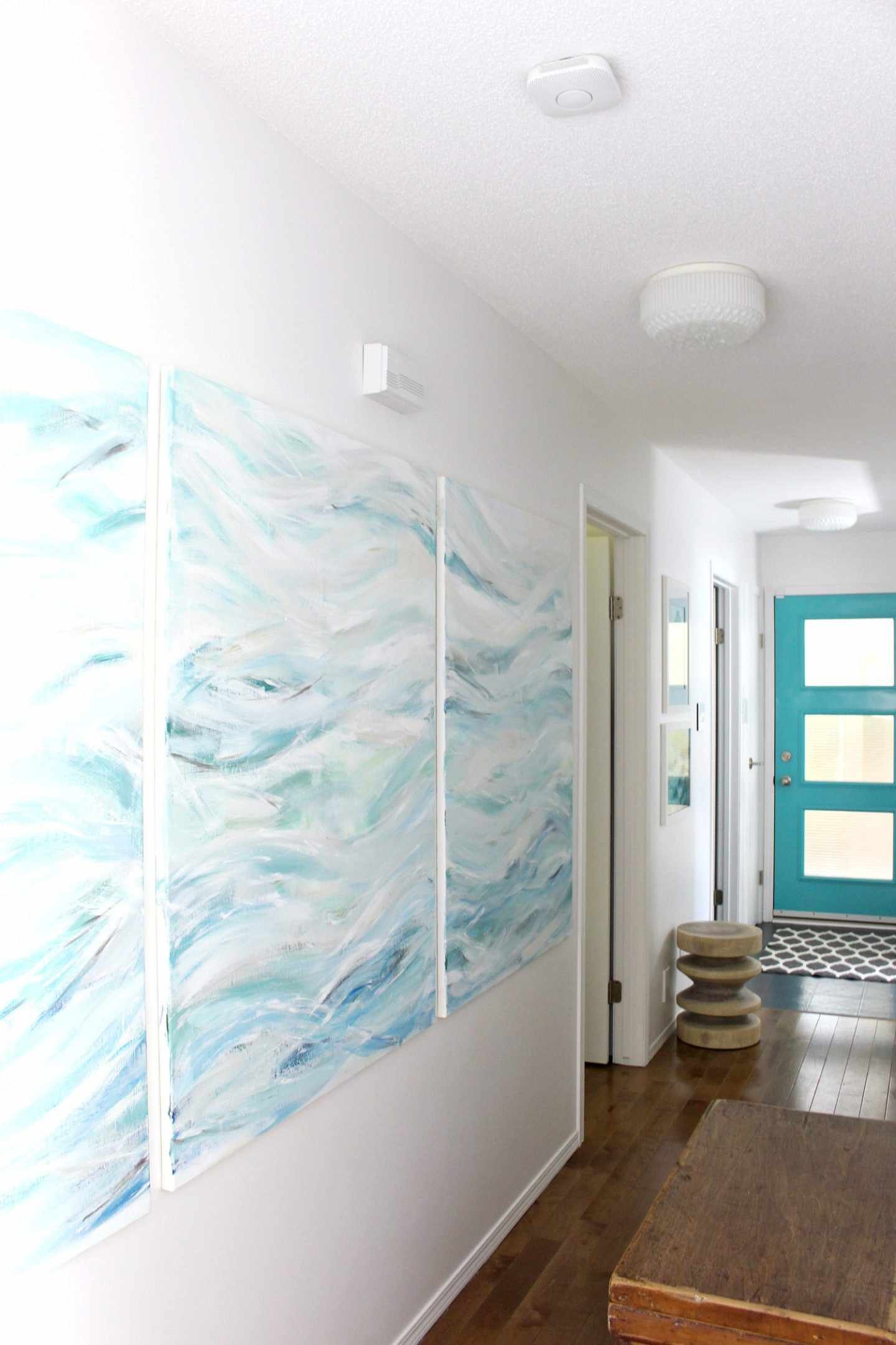 A blue and white painting in a hallway