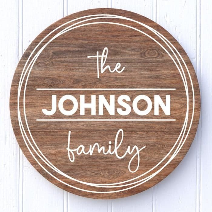 A wooden name plaque hanging on a wall