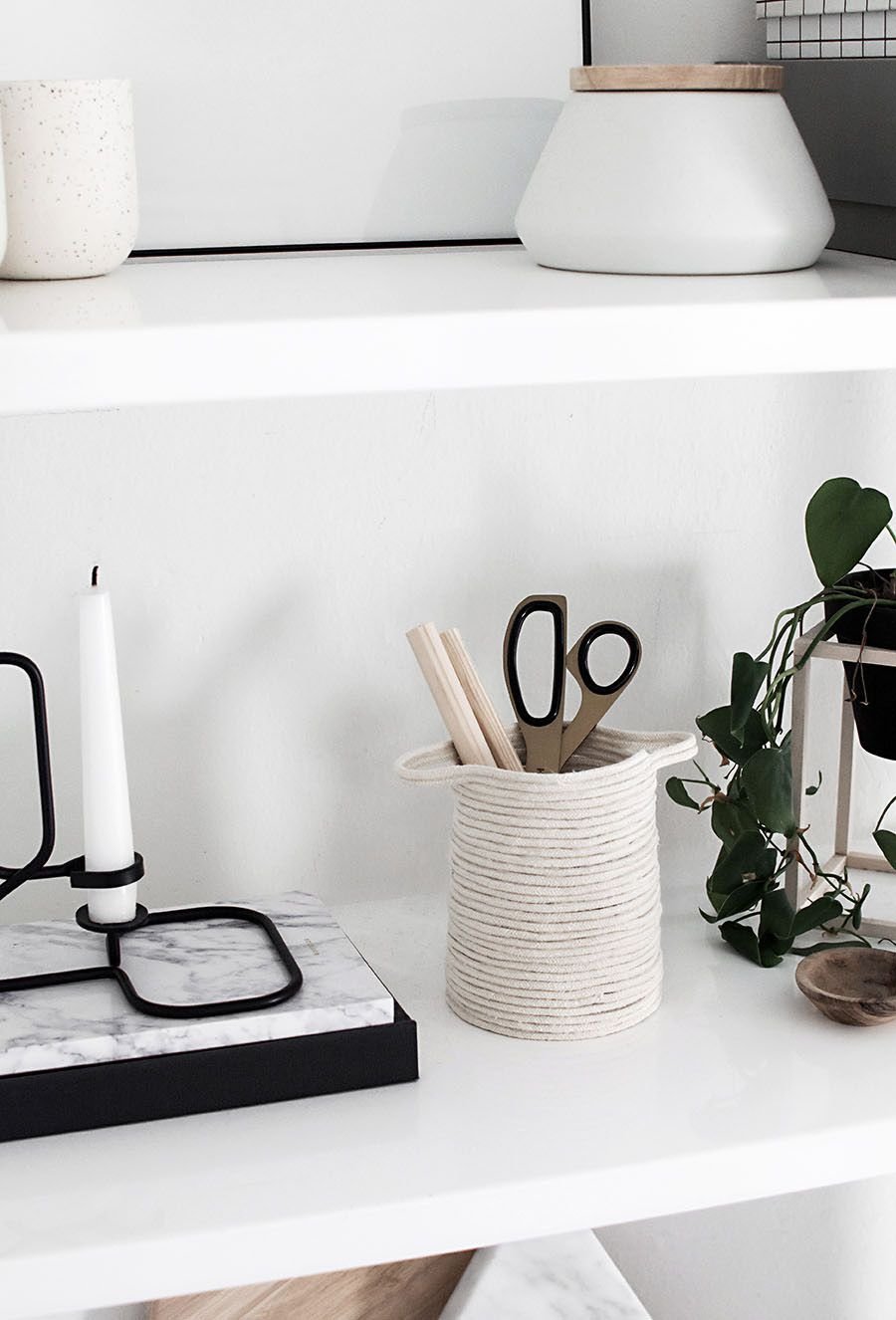 A rope basket holding office supplies