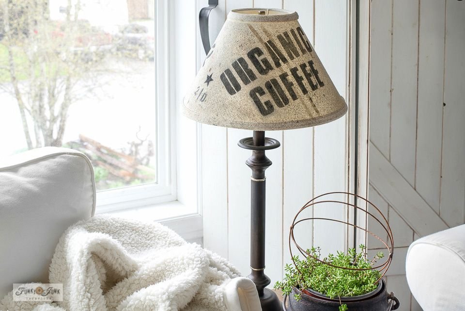 A lamp shade covered with a coffee sack
