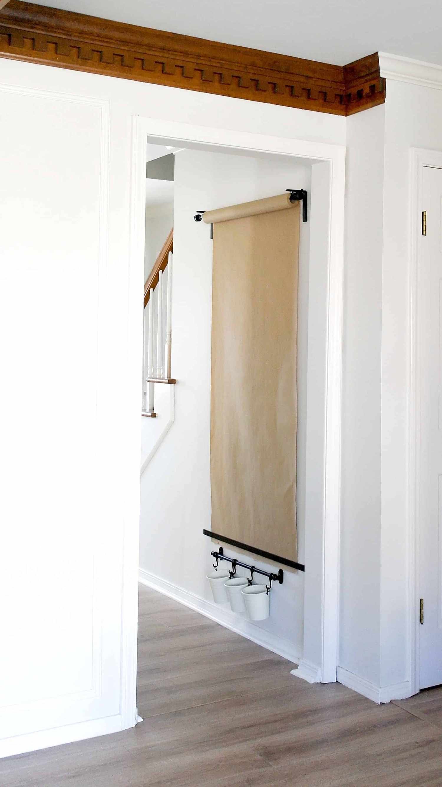A easel on a wall in a hallway