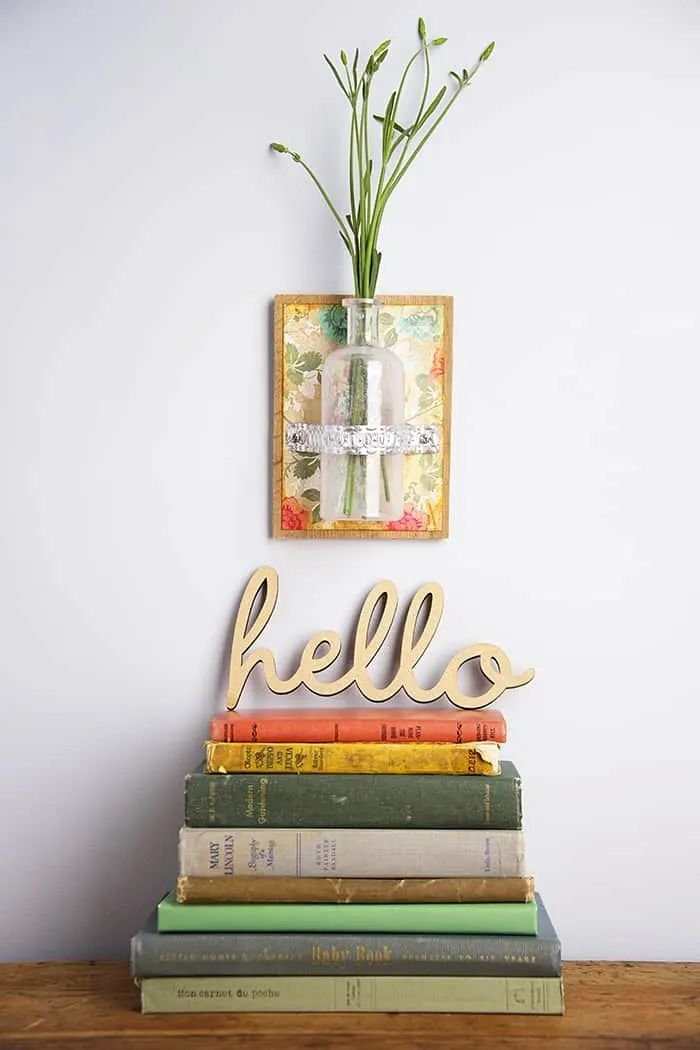 A bottle vase hanging on a wall