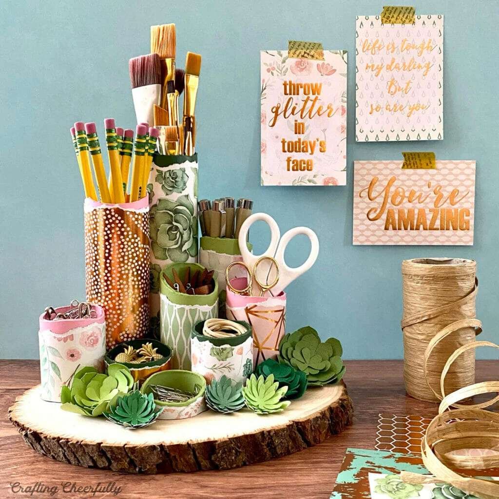 A green and copper desktop organizer made from paper
