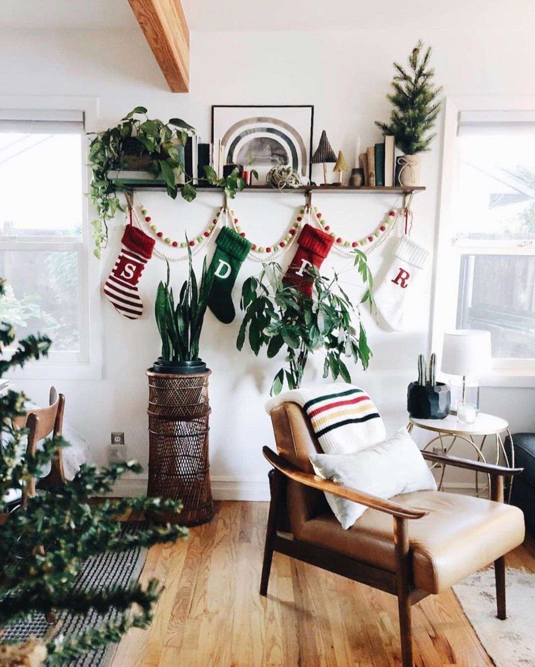 christmas stockings hung from an open shelf
