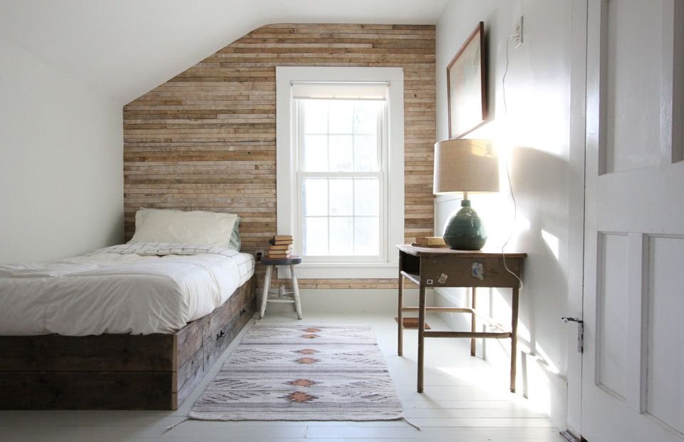 Bedroom with wooden wall