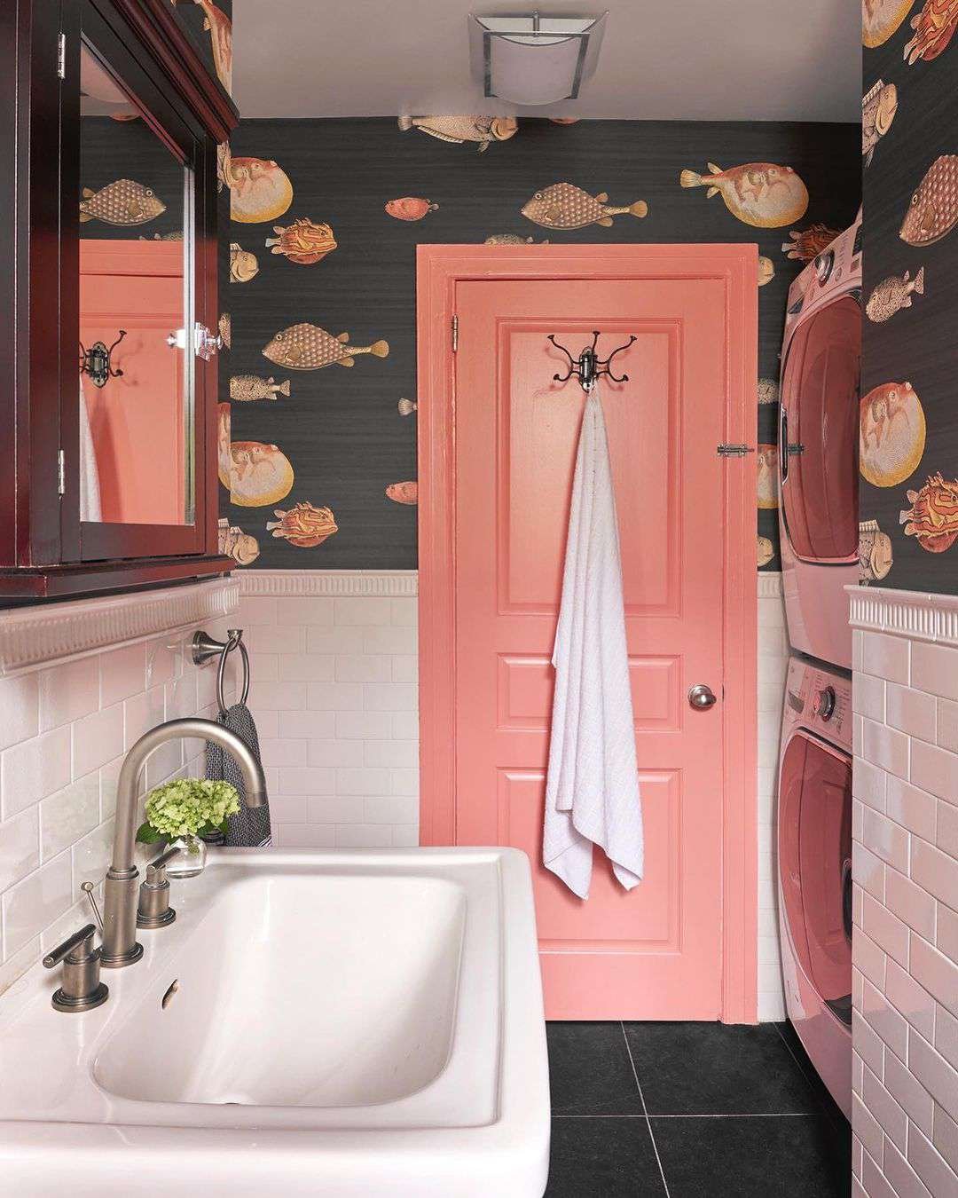 Coral paint color on a bathroom door and trim.