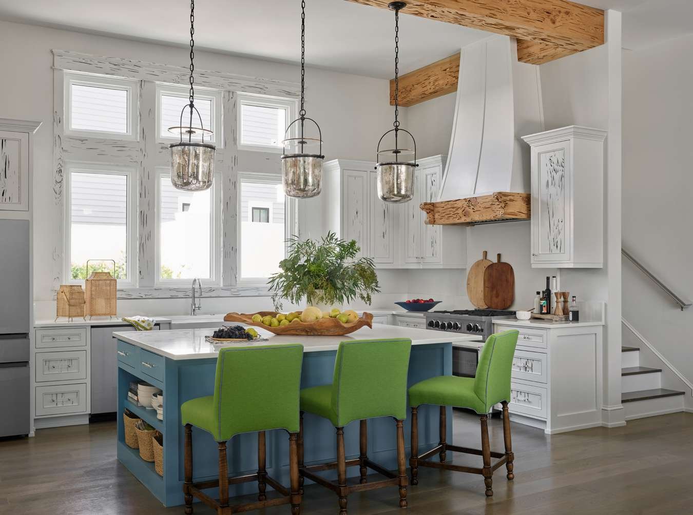white and wood kitchen with colorful island