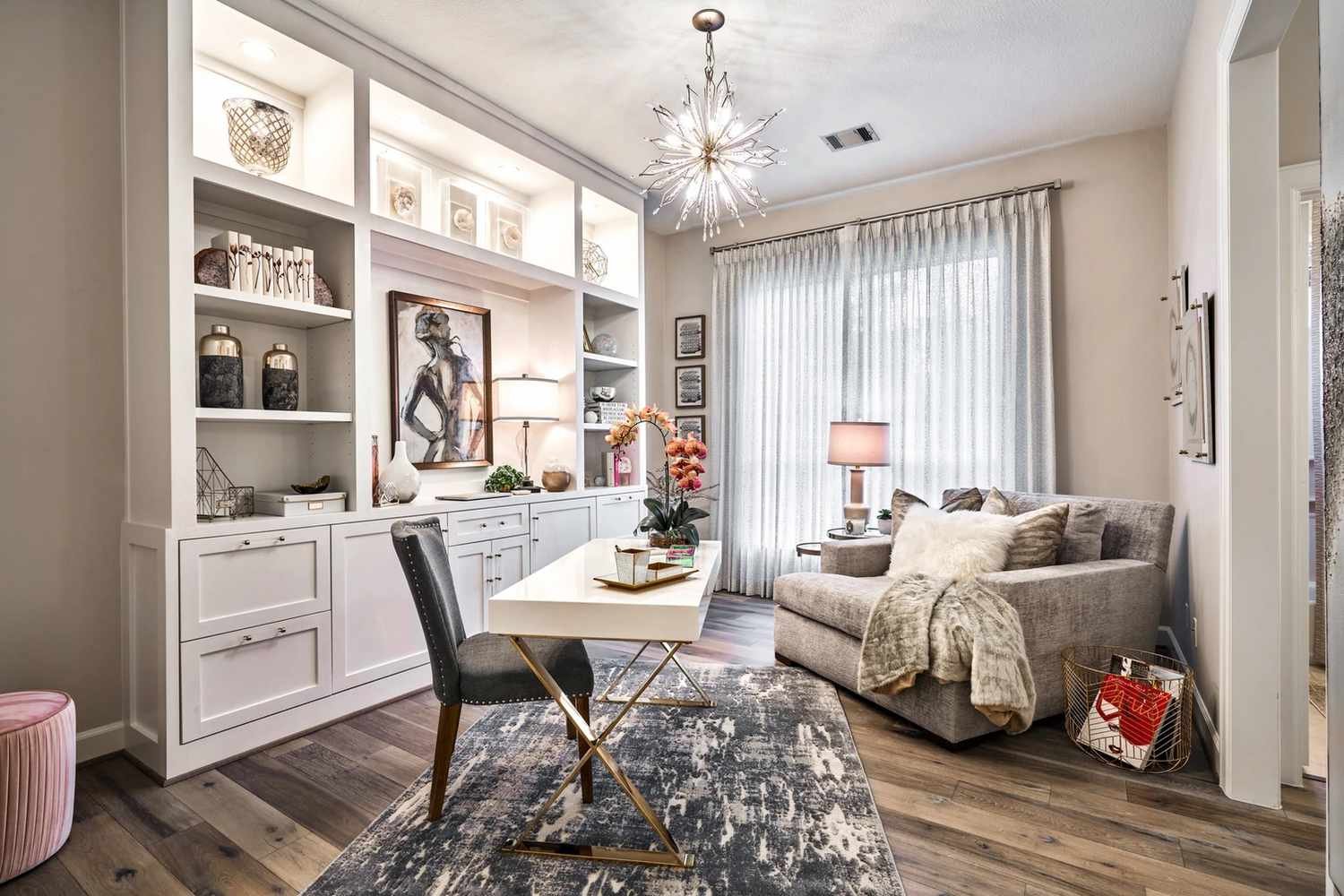 Starburst ceiling light in a modern home office with white built ins