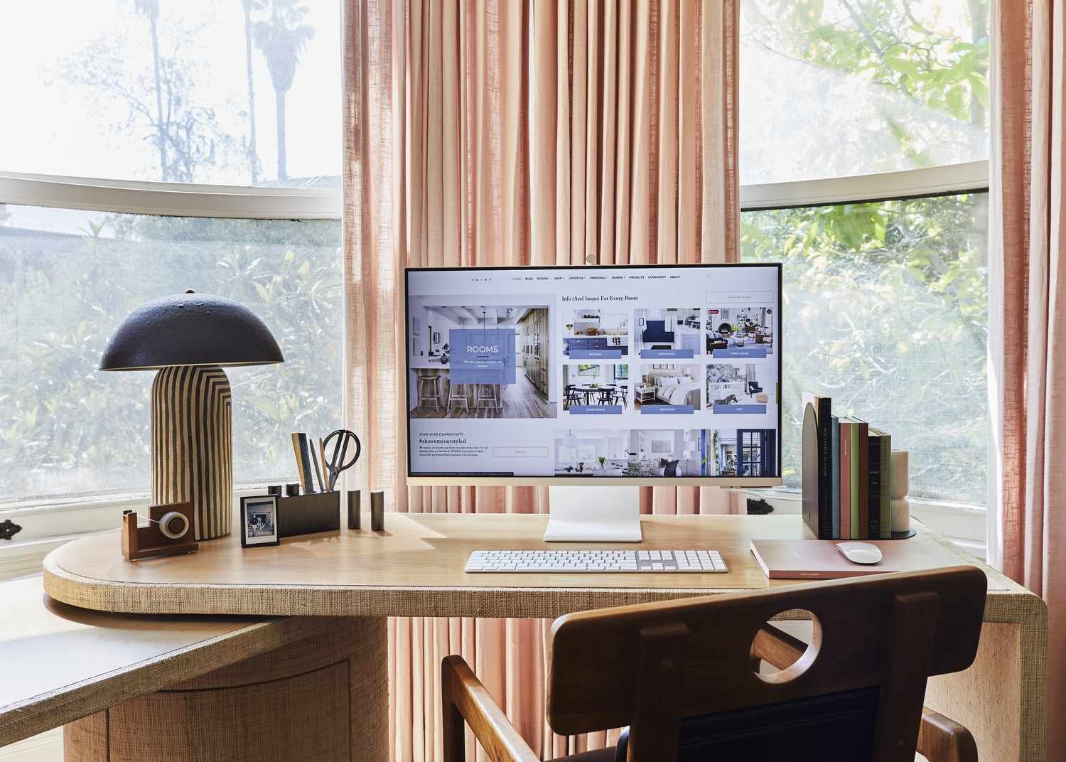Mushroom table lamp on a desk with a computer and various office supplies