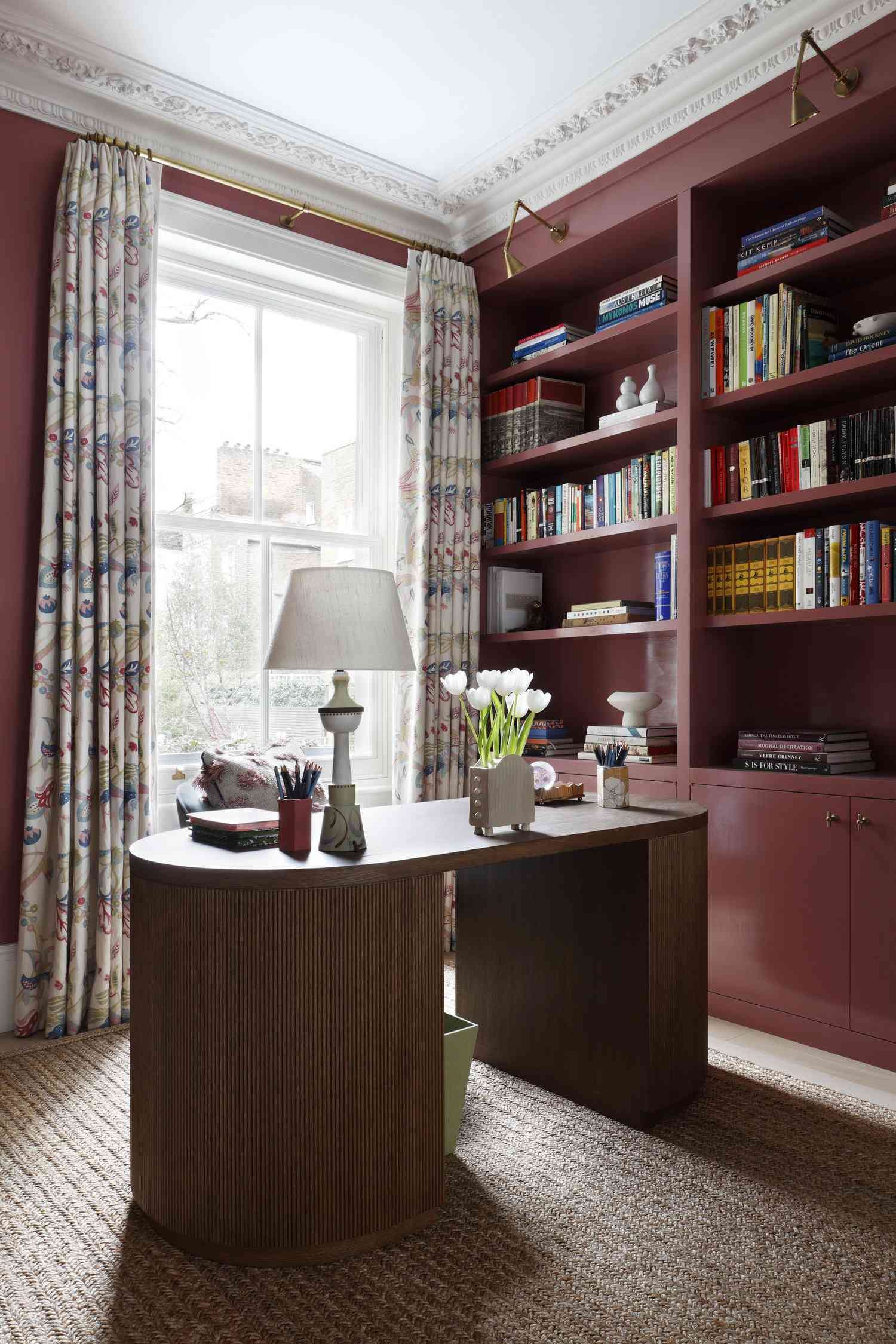 Decorative table lamp on a rounded desk in a home office