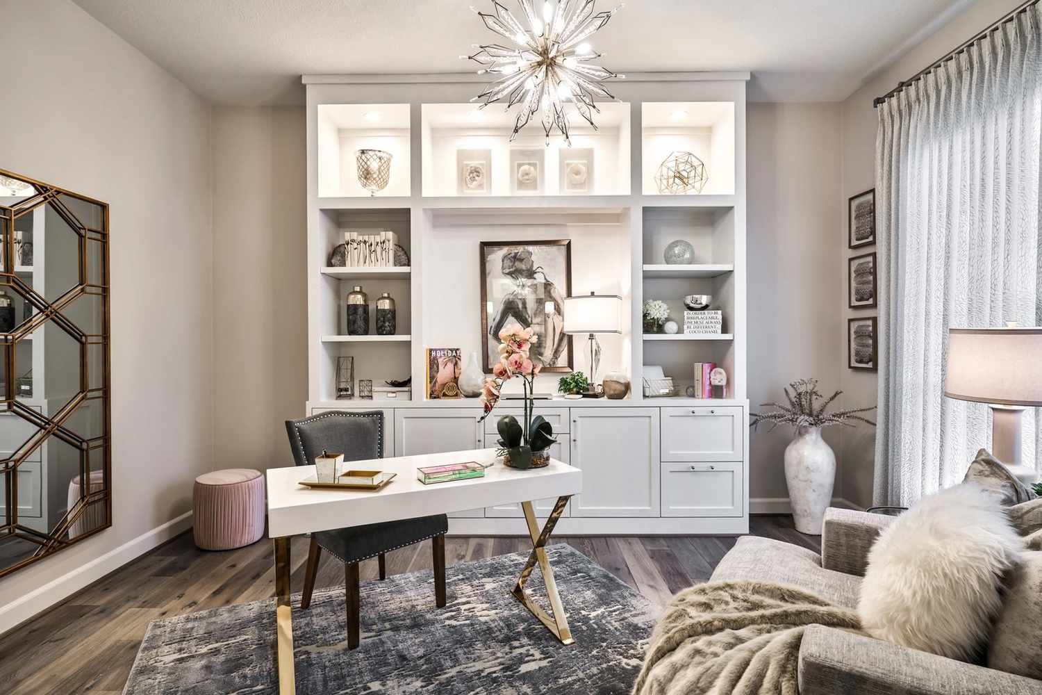 Lights inside built-in bookshelves in a modern home office