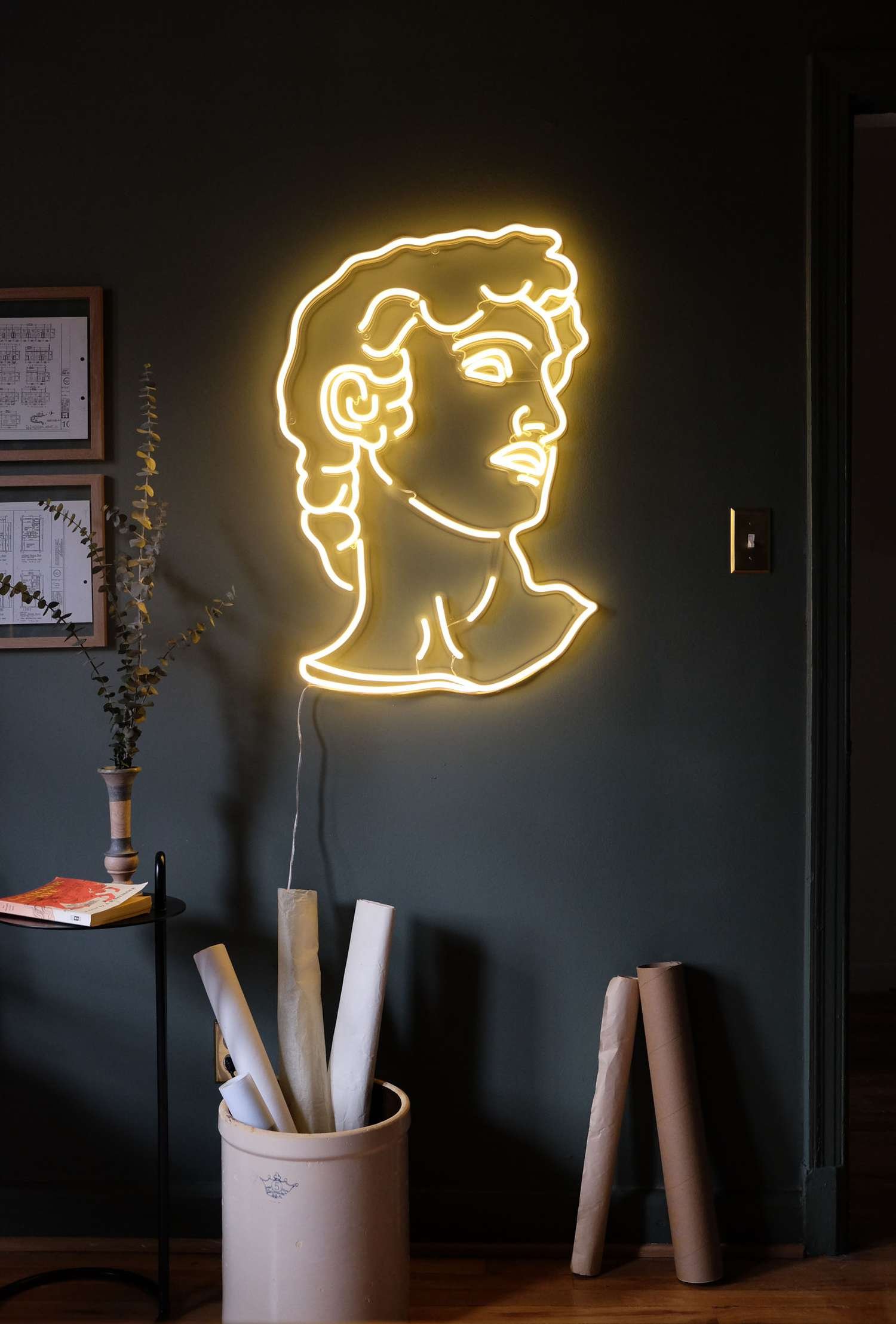 Neon wall light in a dark and moody home office