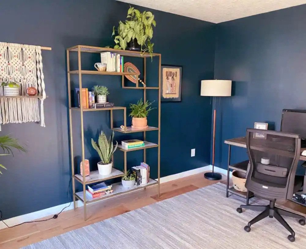 gold shelf next to desk