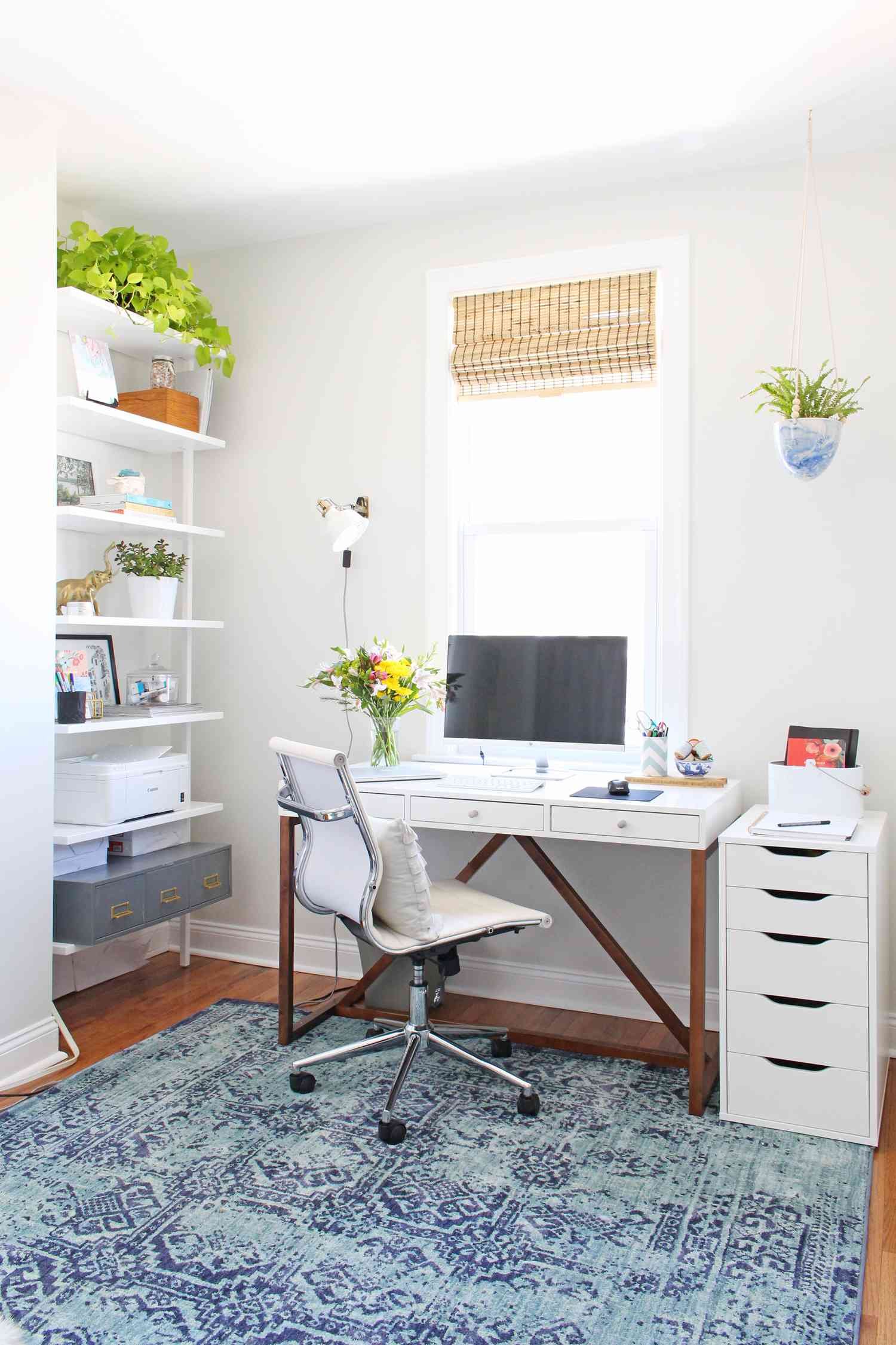 narrow bookshelf next to desk